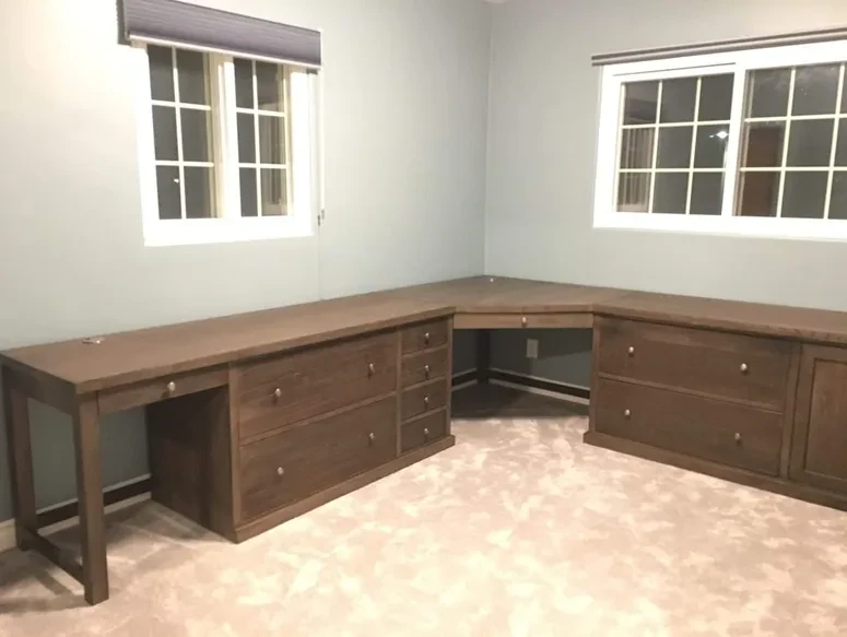 Custom L-shaped walnut desk with built-in storage